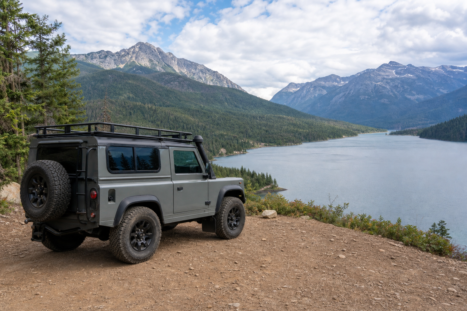A vehicle traveling through a scenic mountain landscape